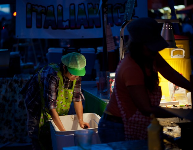 A vendor cleans up after the crowds leave the 2012 H Street Festival